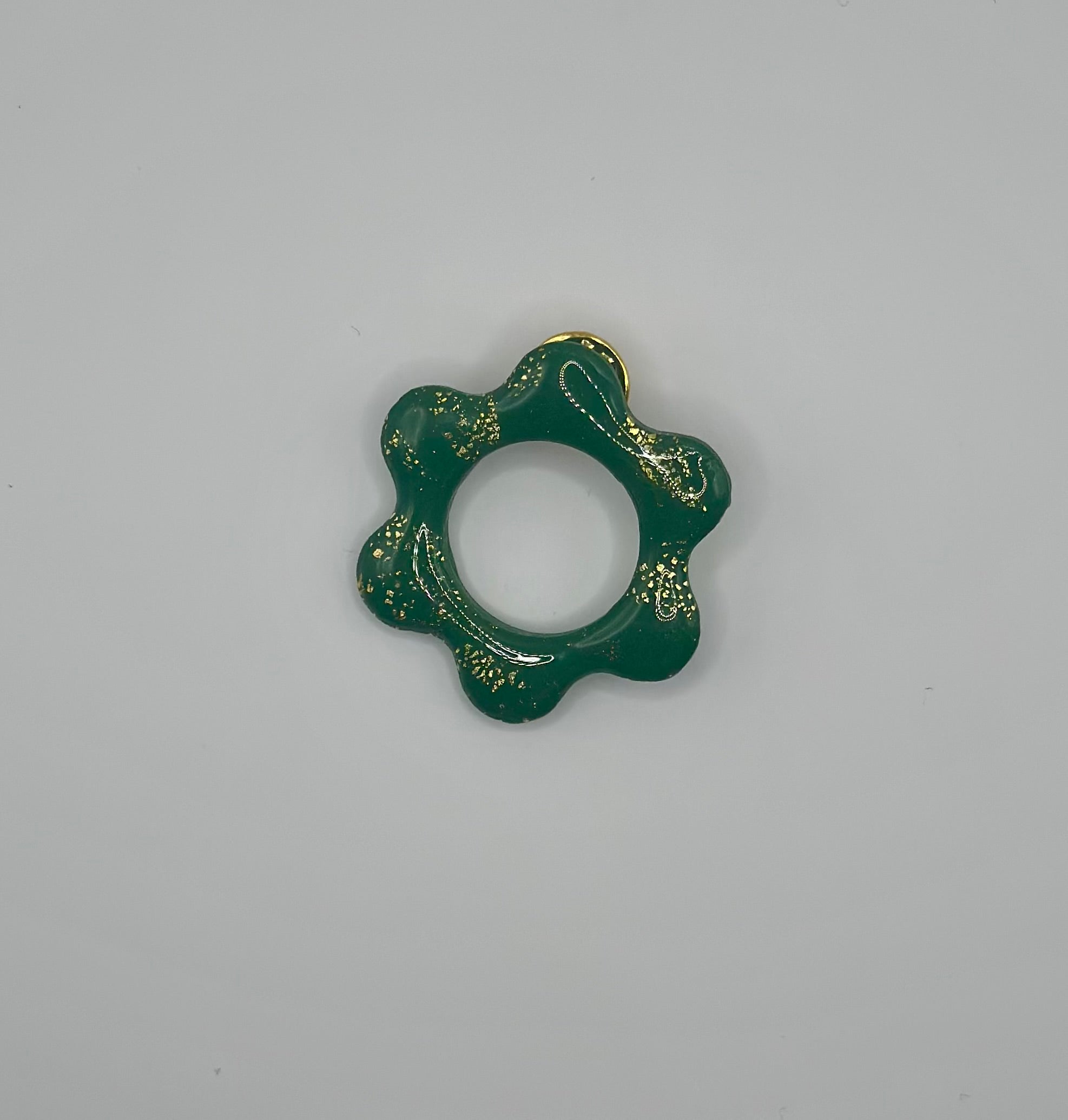 Pin’s de lunette fleur verte et or
