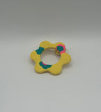 Pin’s de lunette fleur jaune fleuri