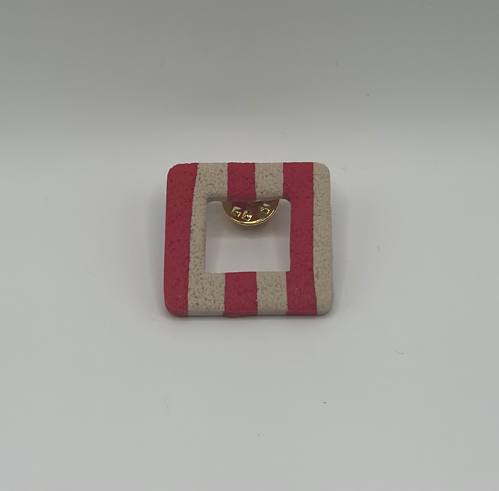 Pin’s de lunette carré à rayures