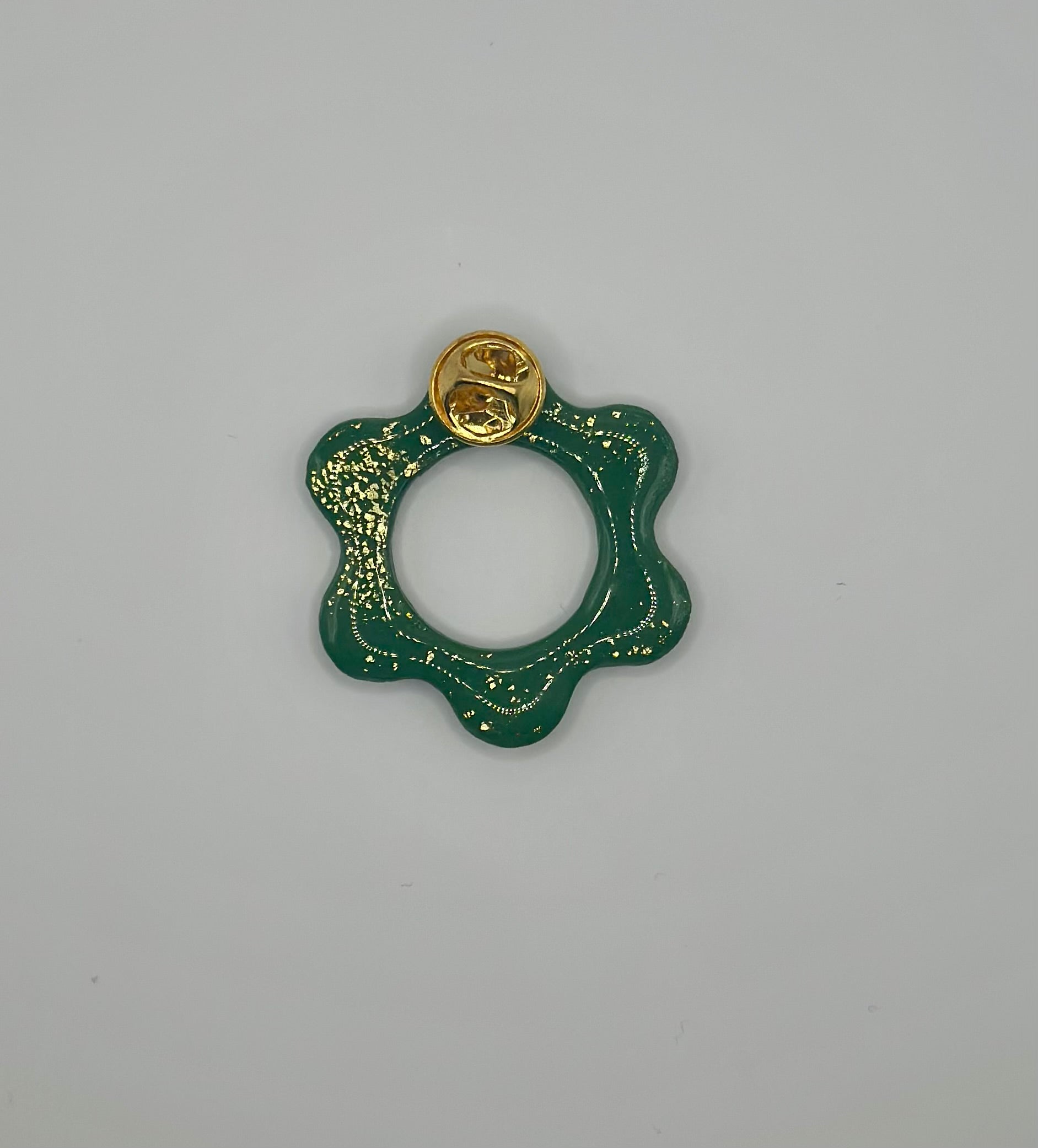 Pin’s de lunette fleur verte et or